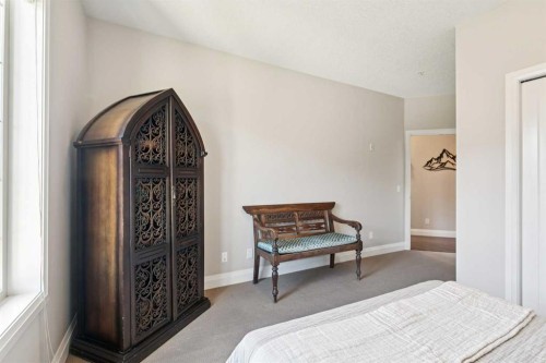 2302-15 Sunset Square, Cochrane, AB - Indoor Photo Showing Bedroom