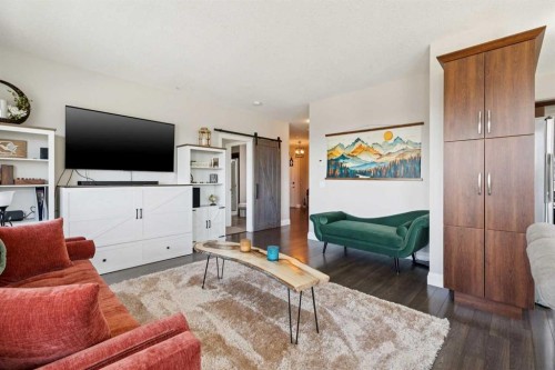 2302-15 Sunset Square, Cochrane, AB - Indoor Photo Showing Living Room
