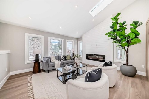 7 Lake Sundance Place Se, Calgary, AB - Indoor Photo Showing Living Room With Fireplace