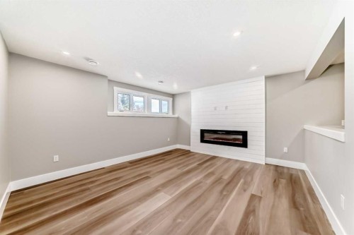 7 Lake Sundance Place Se, Calgary, AB - Indoor With Fireplace