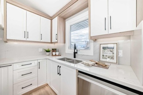 7 Lake Sundance Place Se, Calgary, AB - Indoor Photo Showing Kitchen With Double Sink