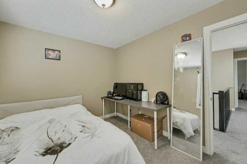 91 Panatella Close Nw, Calgary, AB - Indoor Photo Showing Bedroom