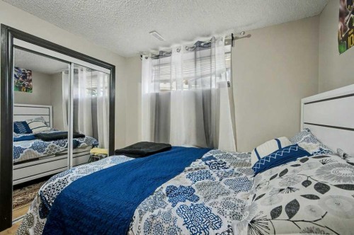 91 Panatella Close Nw, Calgary, AB - Indoor Photo Showing Bedroom