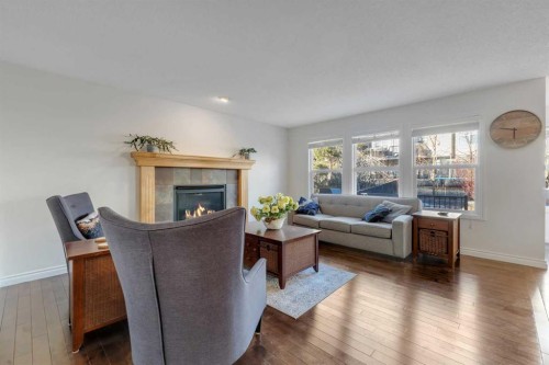 29 Sunset Close, Cochrane, AB - Indoor Photo Showing Living Room With Fireplace