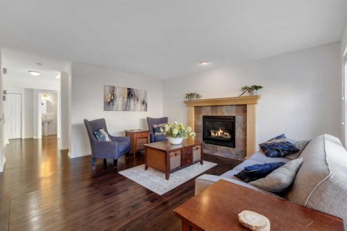 29 Sunset Close, Cochrane, AB - Indoor Photo Showing Living Room With Fireplace