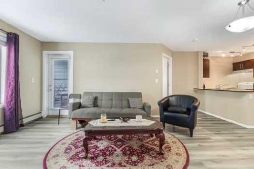 215-355 Taralake Way Ne, Calgary, AB - Indoor Photo Showing Living Room