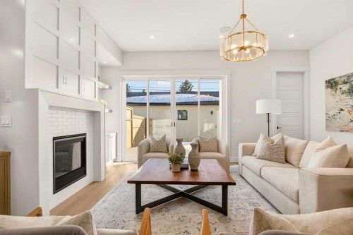2535 2 Avenue Nw, Calgary, AB - Indoor Photo Showing Living Room With Fireplace