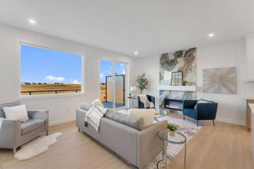 569 Muirfield Crescent, Lyalta, AB - Indoor Photo Showing Living Room With Fireplace