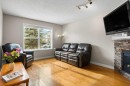 163 Eversyde Circle Sw, Calgary, AB  - Indoor Photo Showing Living Room With Fireplace 