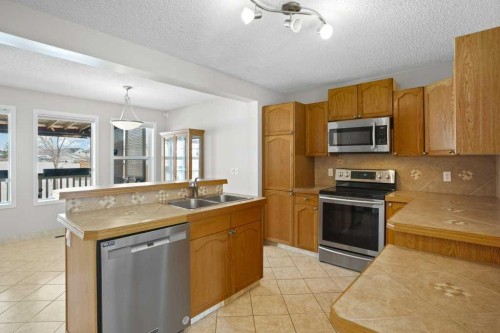 163 Eversyde Circle Sw, Calgary, AB - Indoor Photo Showing Kitchen With Double Sink