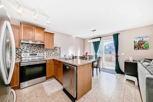238 Bridleridge Way Sw, Calgary, AB - Indoor Photo Showing Kitchen With Double Sink