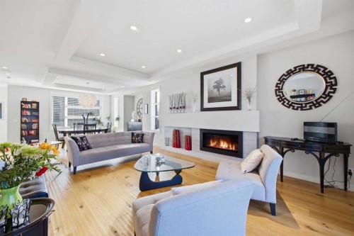 932 5 Avenue Ne, Calgary, AB - Indoor Photo Showing Living Room With Fireplace