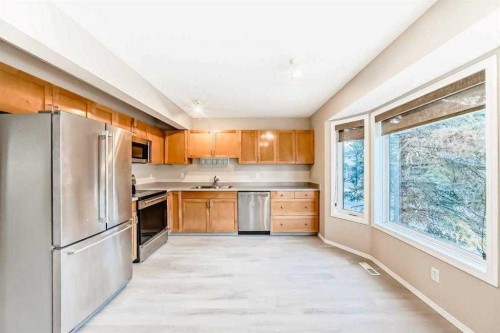 677 Regal Park Ne, Calgary, AB - Indoor Photo Showing Kitchen With Double Sink