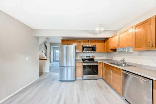 677 Regal Park Ne, Calgary, AB - Indoor Photo Showing Kitchen With Stainless Steel Kitchen With Double Sink