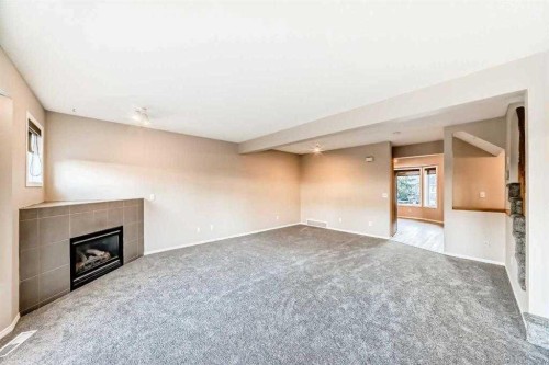 677 Regal Park Ne, Calgary, AB - Indoor With Fireplace