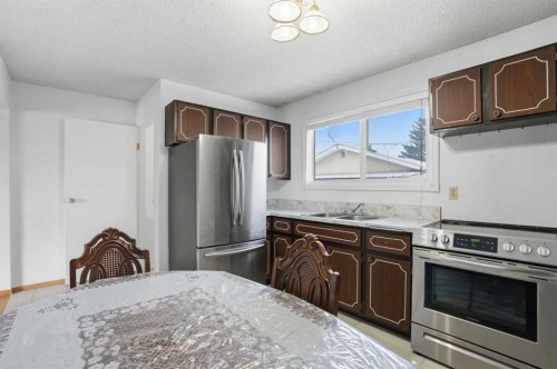 5224 5 Avenue Se, Calgary, AB - Indoor Photo Showing Kitchen With Stainless Steel Kitchen With Double Sink
