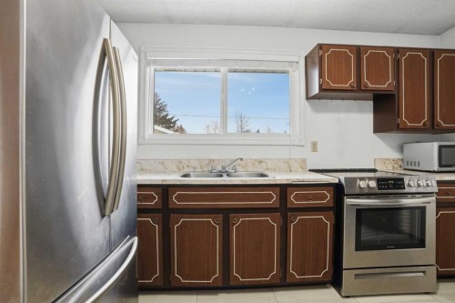 5224 5 Avenue Se, Calgary, AB - Indoor Photo Showing Kitchen With Stainless Steel Kitchen With Double Sink