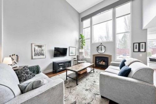 95 Cranleigh Gardens Se, Calgary, AB - Indoor Photo Showing Living Room With Fireplace