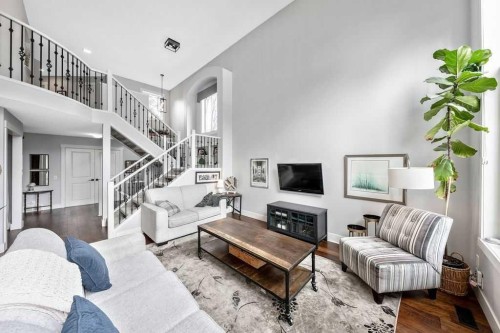95 Cranleigh Gardens Se, Calgary, AB - Indoor Photo Showing Living Room With Fireplace