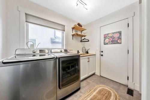 95 Cranleigh Gardens Se, Calgary, AB - Indoor Photo Showing Laundry Room