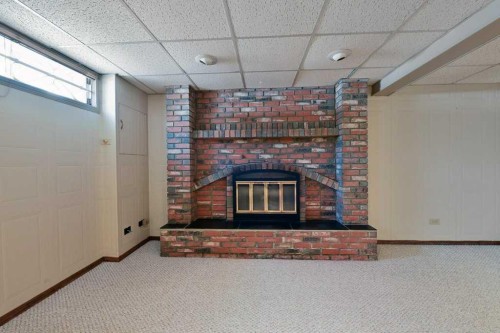 7703 5 Street Sw, Calgary, AB - Indoor With Fireplace