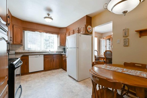7703 5 Street Sw, Calgary, AB - Indoor Photo Showing Kitchen With Double Sink