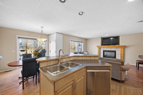83 Cougarstone Way Sw, Calgary, AB - Indoor With Fireplace