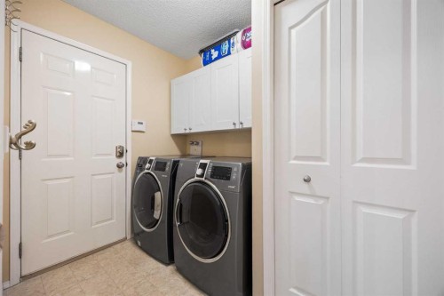83 Cougarstone Way Sw, Calgary, AB - Indoor Photo Showing Laundry Room