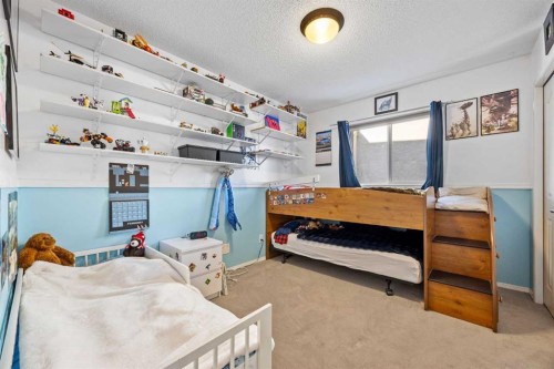83 Cougarstone Way Sw, Calgary, AB - Indoor Photo Showing Bedroom