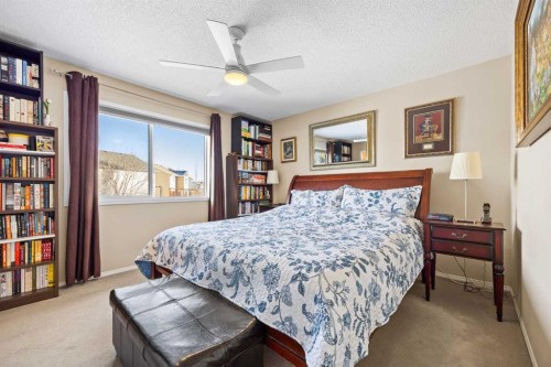83 Cougarstone Way Sw, Calgary, AB - Indoor Photo Showing Bedroom