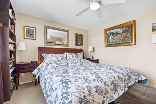 83 Cougarstone Way Sw, Calgary, AB - Indoor Photo Showing Bedroom