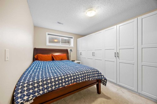 83 Cougarstone Way Sw, Calgary, AB - Indoor Photo Showing Bedroom