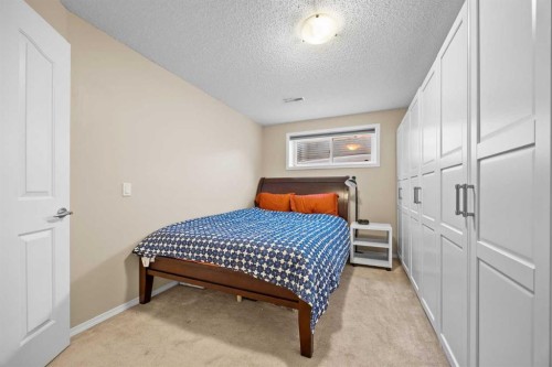 83 Cougarstone Way Sw, Calgary, AB - Indoor Photo Showing Bedroom