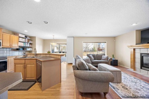 83 Cougarstone Way Sw, Calgary, AB - Indoor With Fireplace