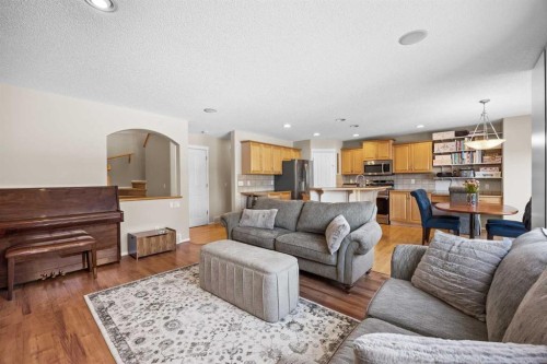 83 Cougarstone Way Sw, Calgary, AB - Indoor Photo Showing Living Room