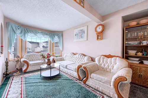 433 Coral Springs Place Ne, Calgary, AB - Indoor Photo Showing Living Room
