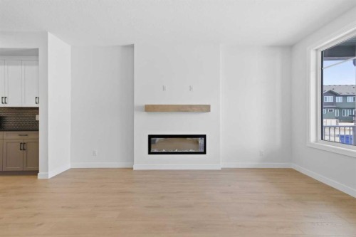35 Belvedere Crescent Se, Calgary, AB - Indoor Photo Showing Living Room With Fireplace