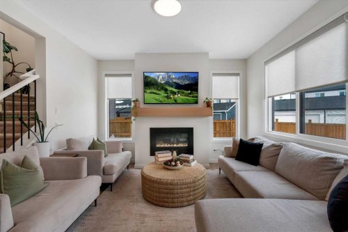 52 Sugarsnap Way Se, Calgary, AB - Indoor Photo Showing Living Room With Fireplace