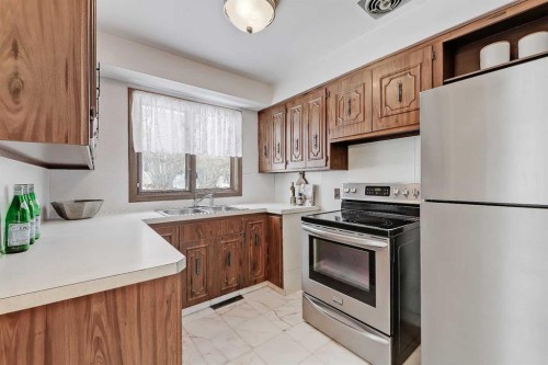 13 Hawthorne Crescent Nw, Calgary, AB - Indoor Photo Showing Kitchen With Double Sink