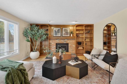 315 Woodhaven Place Sw, Calgary, AB - Indoor Photo Showing Living Room With Fireplace