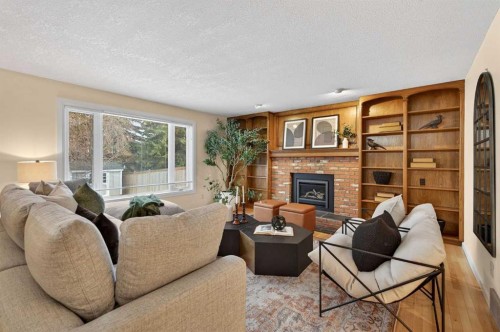 315 Woodhaven Place Sw, Calgary, AB - Indoor Photo Showing Living Room With Fireplace