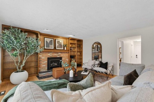 315 Woodhaven Place Sw, Calgary, AB - Indoor Photo Showing Living Room With Fireplace