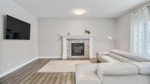 39 Mt Douglas Point Se, Calgary, AB - Indoor Photo Showing Living Room With Fireplace