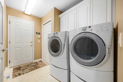 118 Eagleview Heights, Cochrane, AB - Indoor Photo Showing Laundry Room