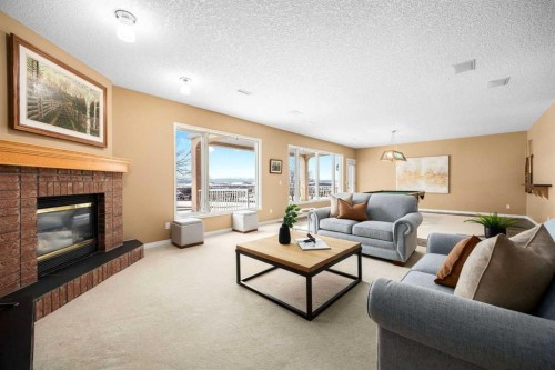 118 Eagleview Heights, Cochrane, AB - Indoor Photo Showing Living Room With Fireplace