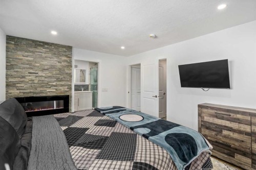 119 Silvercreek Close Nw, Calgary, AB - Indoor With Fireplace