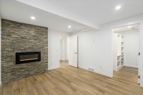 119 Silvercreek Close Nw, Calgary, AB - Indoor With Fireplace