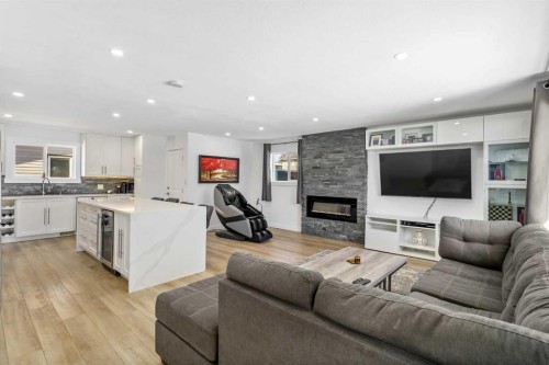 119 Silvercreek Close Nw, Calgary, AB - Indoor Photo Showing Living Room With Fireplace