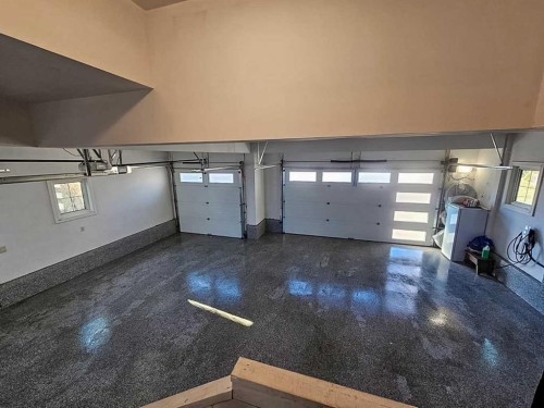 90 Silverado Ranch Way Sw, Calgary, AB - Indoor Photo Showing Garage
