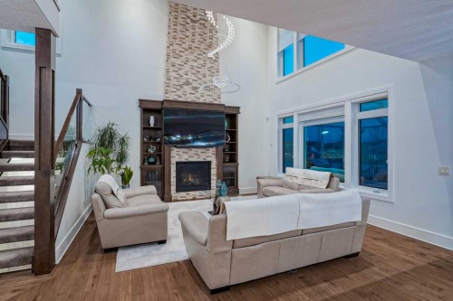 90 Silverado Ranch Way Sw, Calgary, AB - Indoor Photo Showing Living Room With Fireplace